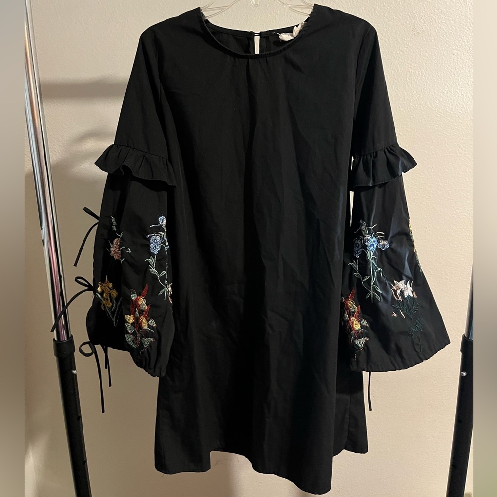 Black dress with floral patterned sleeves